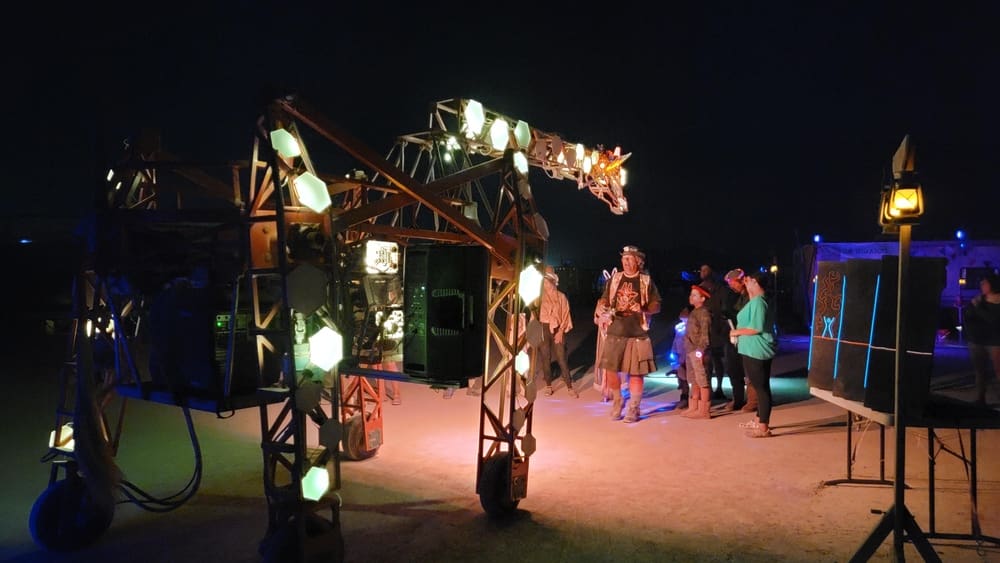 a giraffe art piece at kidsville in Burning Man