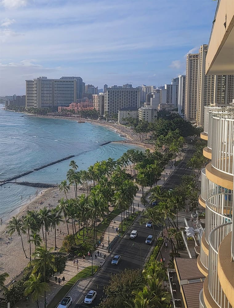 the view looking west across waikiki beach, taken from the balcony at the twin fin hotel
