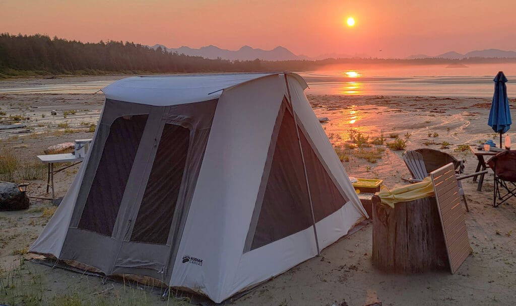 a kodiak canvas tent set up on the beach in vancouver island