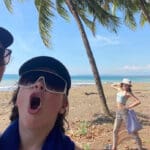 A family of four poses with silly faces on the beach in Costa rica
