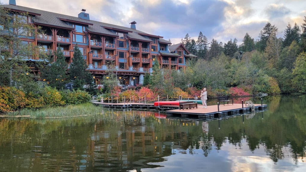 a mother and baby look out on the dock behind nita lake lodge in whistler bc