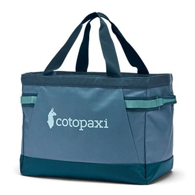 A studio image of the Cotopaxi Allpa 60L Gear Hauler Beach Tote against a white background