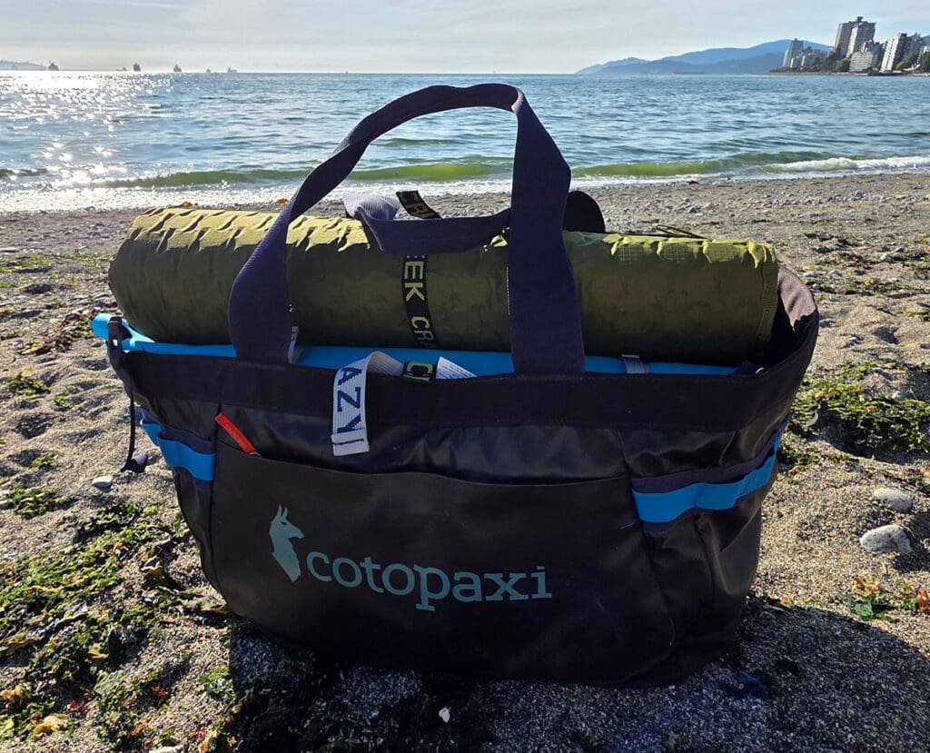 The cotopaxi allpa 60L gear hauler fully loaded for our test of the best beach totes