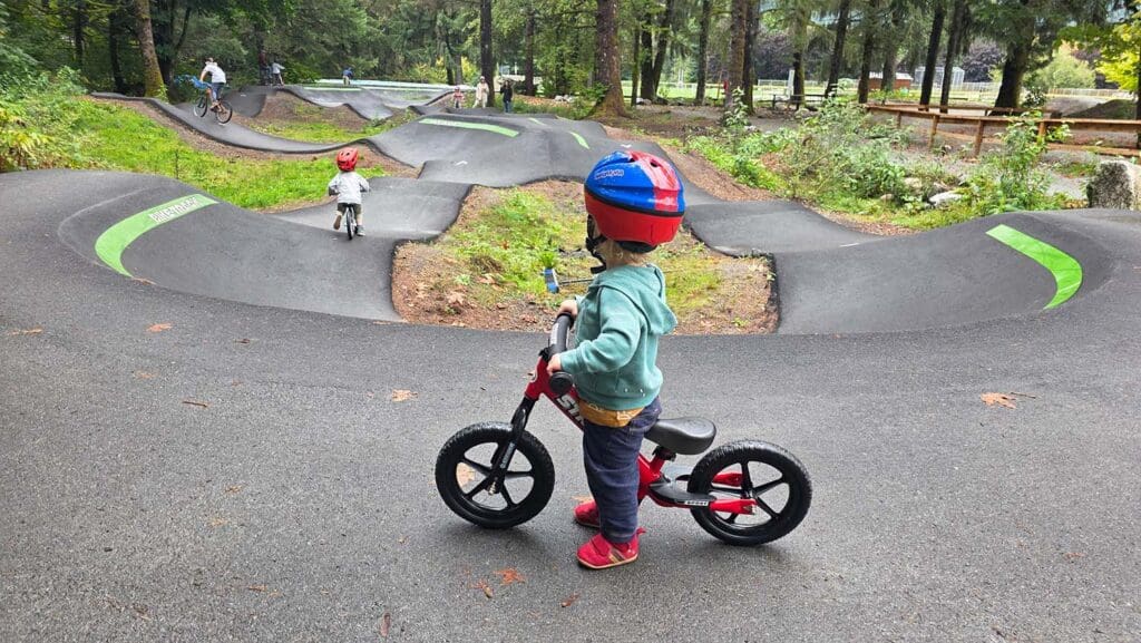 a young child looks onto the pump track