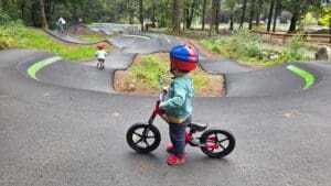 a young child looks onto the pump track