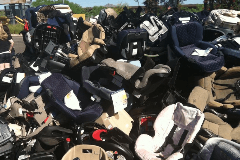 a pile of old car seats headed for the landfill