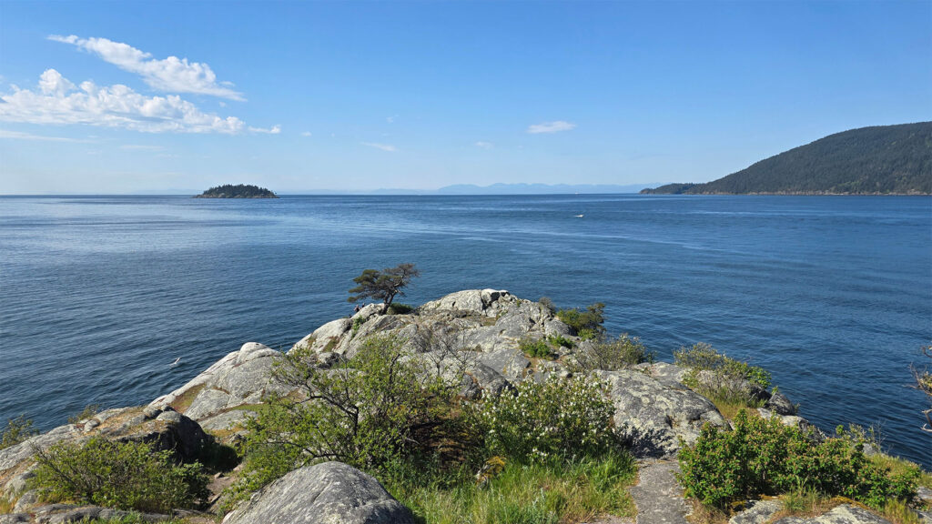 A view looking southward from Whyte Islet toward the Salish Sea and Vancovuer Island on a clear sunny day