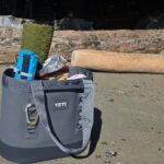 an image of the yeti camino 35 beach bag fully loaded on the beach