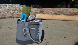an image of the yeti camino 35 beach bag fully loaded on the beach