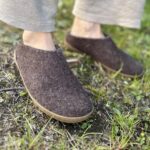 a pair of glerups low cut slippers with rubber sols in the grass
