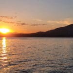 a view of the sunset from third beach in Stanley Park, Vancouver, BC